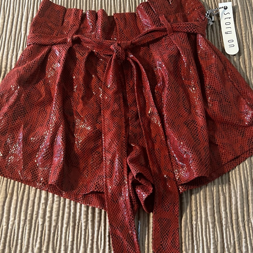It is a cute new short with animal print in red color